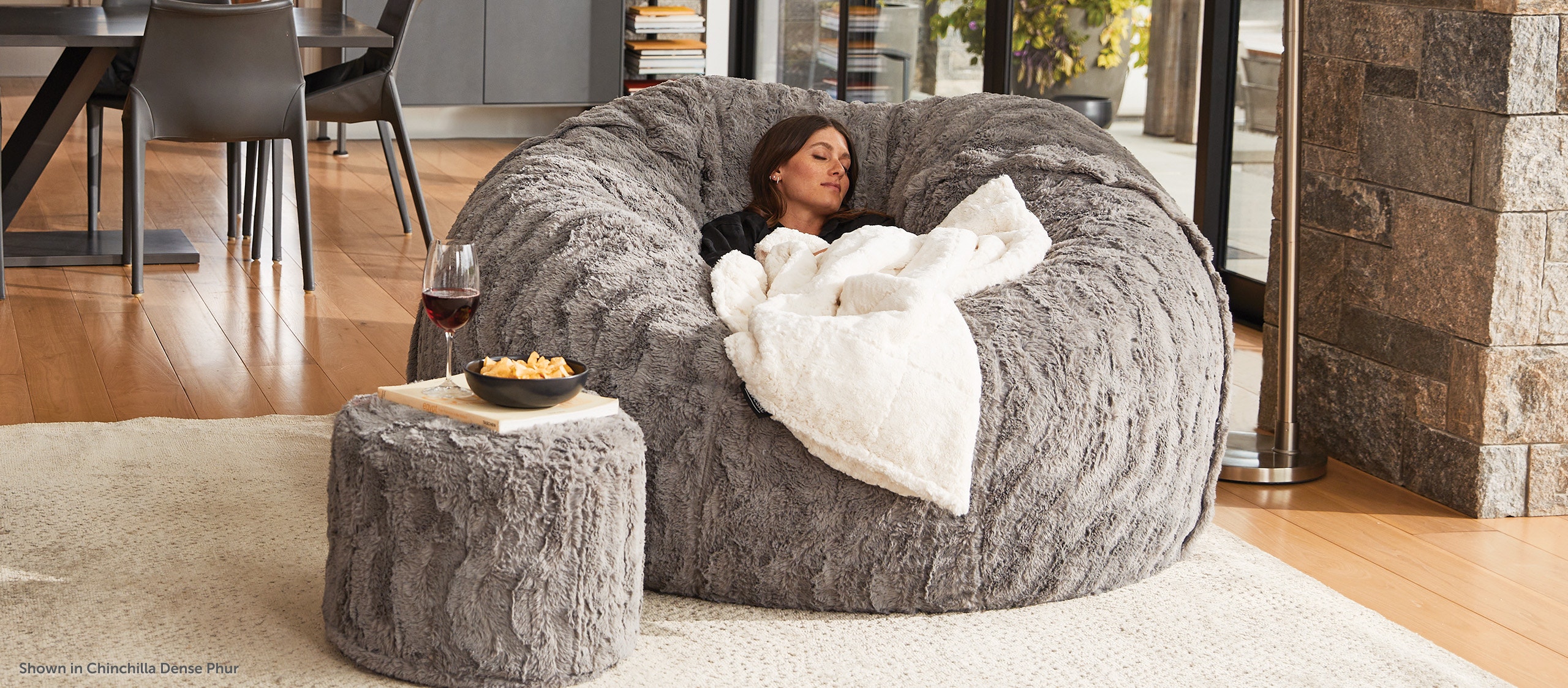 Couple enjoying Harman Kardon surround sound in their Lovesac Sectional couch.