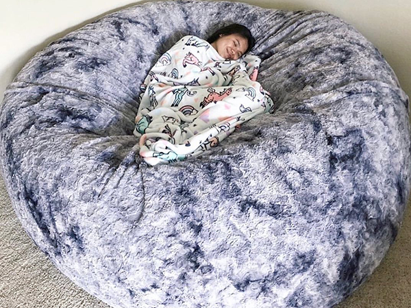 Girl napping on her Lovesac.